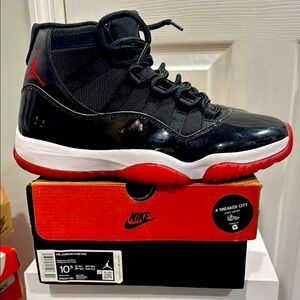 Air Jordan Retro 11 
Black/True Red/White
Size 10.5 Mens